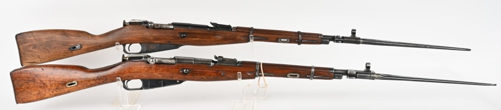 PAIR OF MOSIN - NAGANT M44 CARBINES 7.62 X 54R: SERIAL NUMBER: AS11329 BARREL: 20" CALIBER: 7.62X54R MANUFACTURED: 1952 IN POLAND Import marked. Blue steel finish with standard sights and attached bayonet. Hardwood stock and steel butt plate. Clean