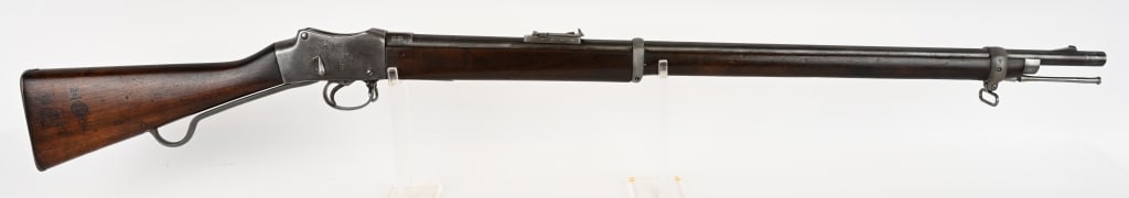 BRITISH ENFIELD MARTINI-HENRY MK IV LONG LEVER: SERIAL NUMBER: D1467 BARREL: 33". CALIBER: .577-450. MANUFACTURED: 1887. This gun was made at the Enfield factory, and later found itself in Nepal, with Nepalese markings on the right side of the stoc