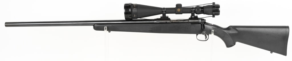 SAVAGE MODEL 12 BOLT ACTION LEFT HAND RIFLE .223: SERIAL NUMBER: G233891 BARREL: 26" CALIBER: .223 REM. MANUFACTURED: 2000's. Metal is blue finish steel with Simmons 6.5-20x50 scope is mounted. Black polymer stock with rubber butt plate. This rifle i
