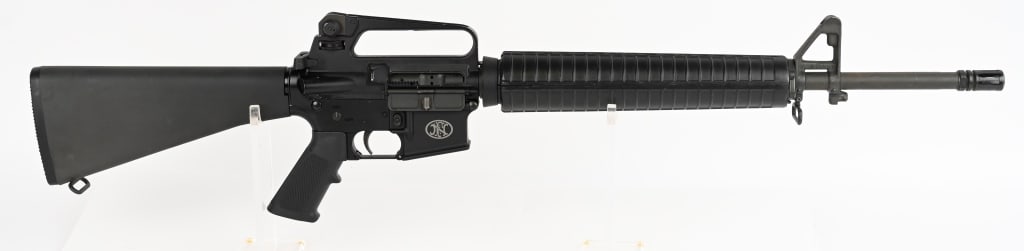FN MODEL FN15 SEMI AUTOMATIC RIFLE: SERIAL NUMBER: FNB001926. BARREL: 20". CALIBER: MULTI / 5.56 NATO. this FN features A2 upper receiver, anodized lower receiver, clam shell hand guard, front adjustable post sight, A2 pistol grip and a