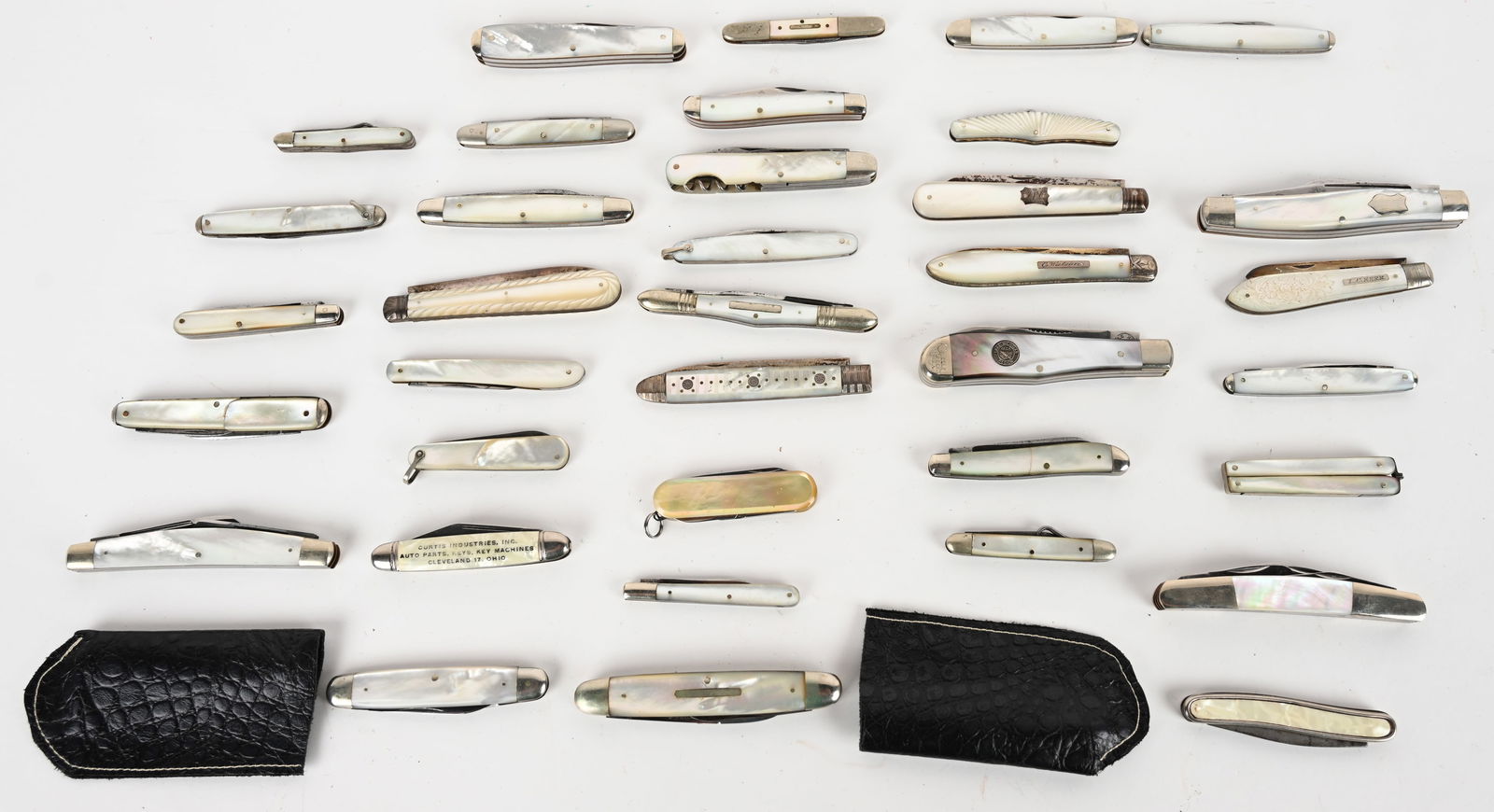 LOT OF PEARL FOLDING KNIFE BEAUTIES: This lot contains 36 pearl handle folding knives from brands such as Cripple Creek, United, Wostenholm, Rostfrei, James Dewsnap, A.M. Geldart, WARDS, R.C. Co., H&B, and Excelsior. Good To Excellent co