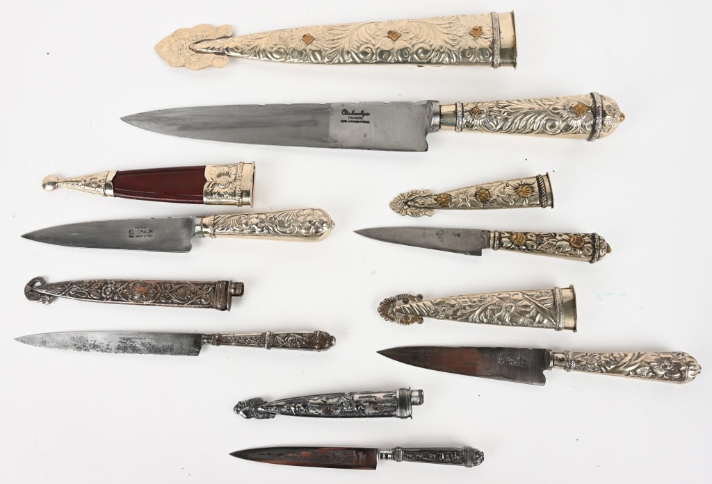 LOT OF ALPACA SILVER ARGENTINIAN GAUCHO KNIVES: This is a lot of 6 gaucho knives from brands like El Caja and Atahualpa. Blade and OAL sizes from: 8 5/8" / 15 3/4" down to 4" / 6 7/8". CONDITION: Very Good. One has developed a dark patina.
