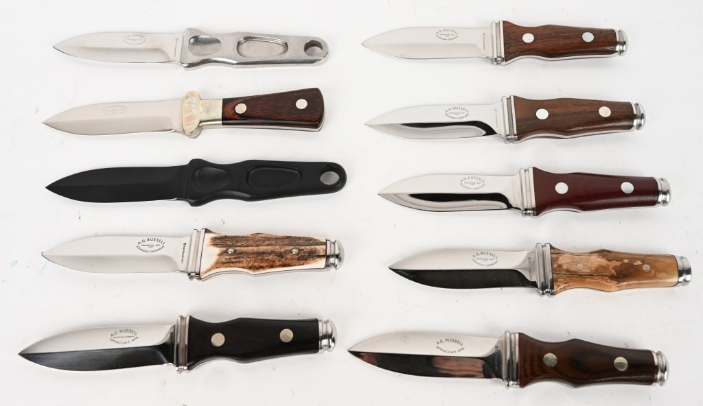 10- AG RUSSELL 1977 BOOT DAGGERS: This lot contains ten assorted boot daggers by A.G. Russell. Blade: 3 1/4". OAL: 3 1/4". Handle materials: Micarta, light and dark wood, jigged bone, and bone. CONDITION: Excellent