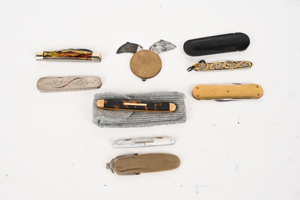 AN ASSORTMENT OF VERY UNIQUE KNIVES: (1) Paul Myers Custom folding pocketknife with intricate engraving and detailing on handle edges. Blade: 2". OAL: 4 15/16". There is some adhesive reside that will clean up. (1) Crandall 3 blade pocke