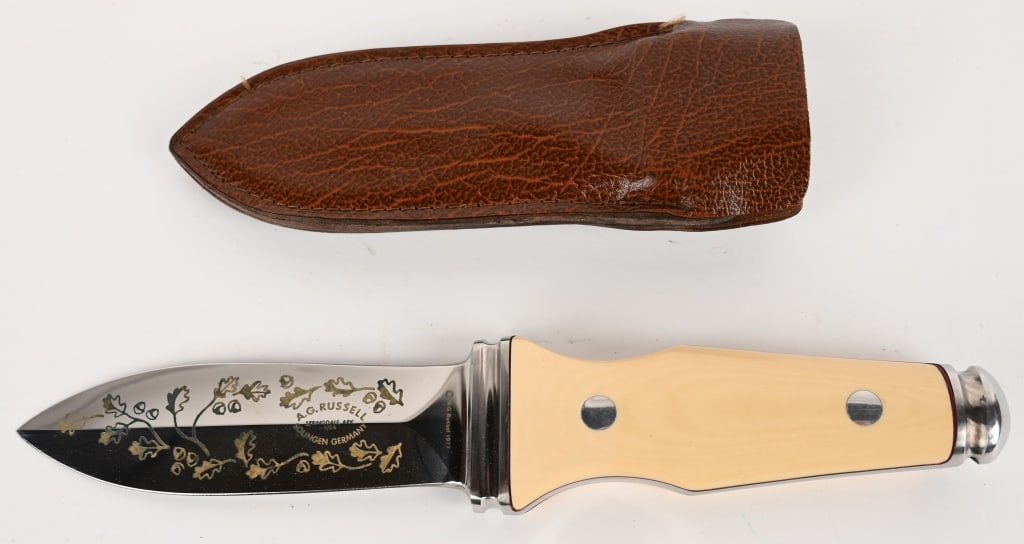 VNTG 1977 AG RUSSELL STING II DAGGER KNIFE: RARE RARE 1977 AG Russell Sting II Special Edition Oak Leaf 8" Large Dagger Boot Knife. Blade: 3 3/4". OAL: 8". This beautiful A.G. Russell knife was originally made circa 1977. This is the gold oak l