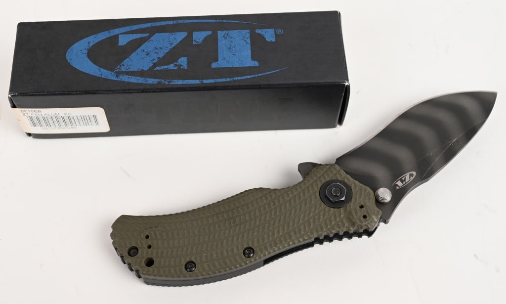 ZERO TOLERANCE 0301 ASSISTED OPENING KNIFE: Blade: 3 1/2". 8 1/2". The Zero Tolerance 0301 folder, co-designed by Ken Onion and Strider, features the SpeedSafe assisted opening system. The handle has a 3D machined Ranger Green G10 scale over st