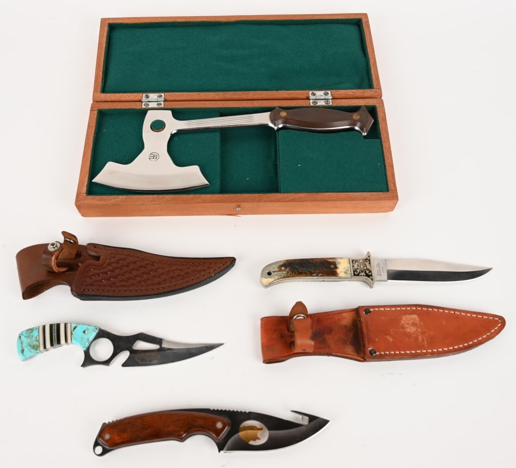ASSORTMENT OF CUSTOM KNIVES: (1) High polished hatched with felt lined presentation box. Condition: Very Good. 98%. The presentation box has started to delaminate. (1) Buck model 693 featuring a brass tone bear figure in the blad