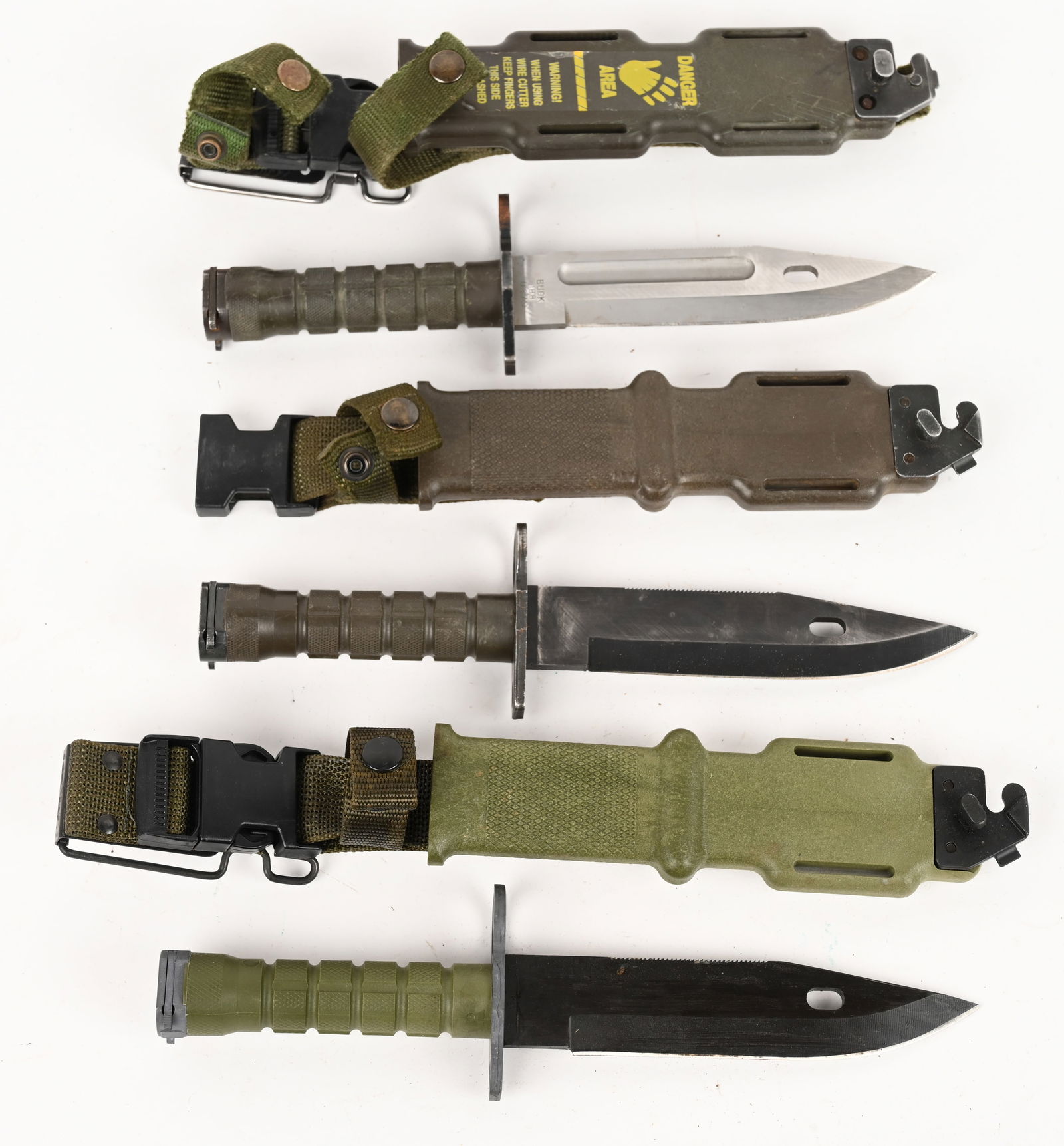 LOT OF THREE MILITARY M-9 KNIVES: This lot contains: (1) LAN-CAY M9 (1) Ontario Knife Co. M-9 (1) BUCK 188 M9 PHROBIS III