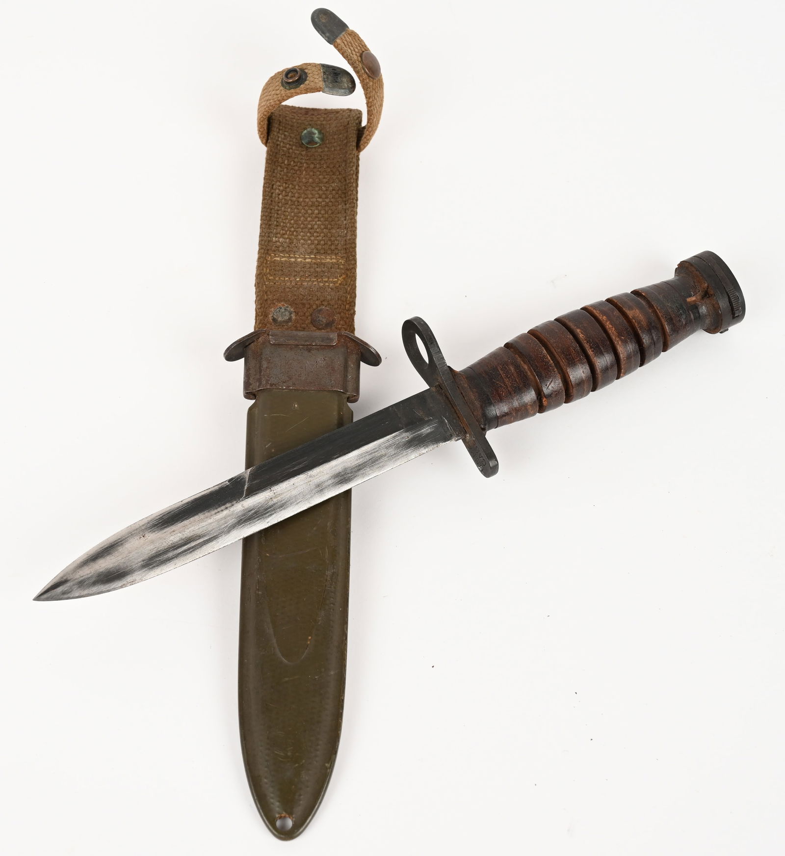 RARE US M4 / CASE M1 CARBINE BAYONET: This lot contains a rare M4 bayonet. The pommel is marked "S" and "31". The guard is marked with a flaming bomb. The scabbard is marked "USM*" and "B.M. CO." CONDITION: Very Good.