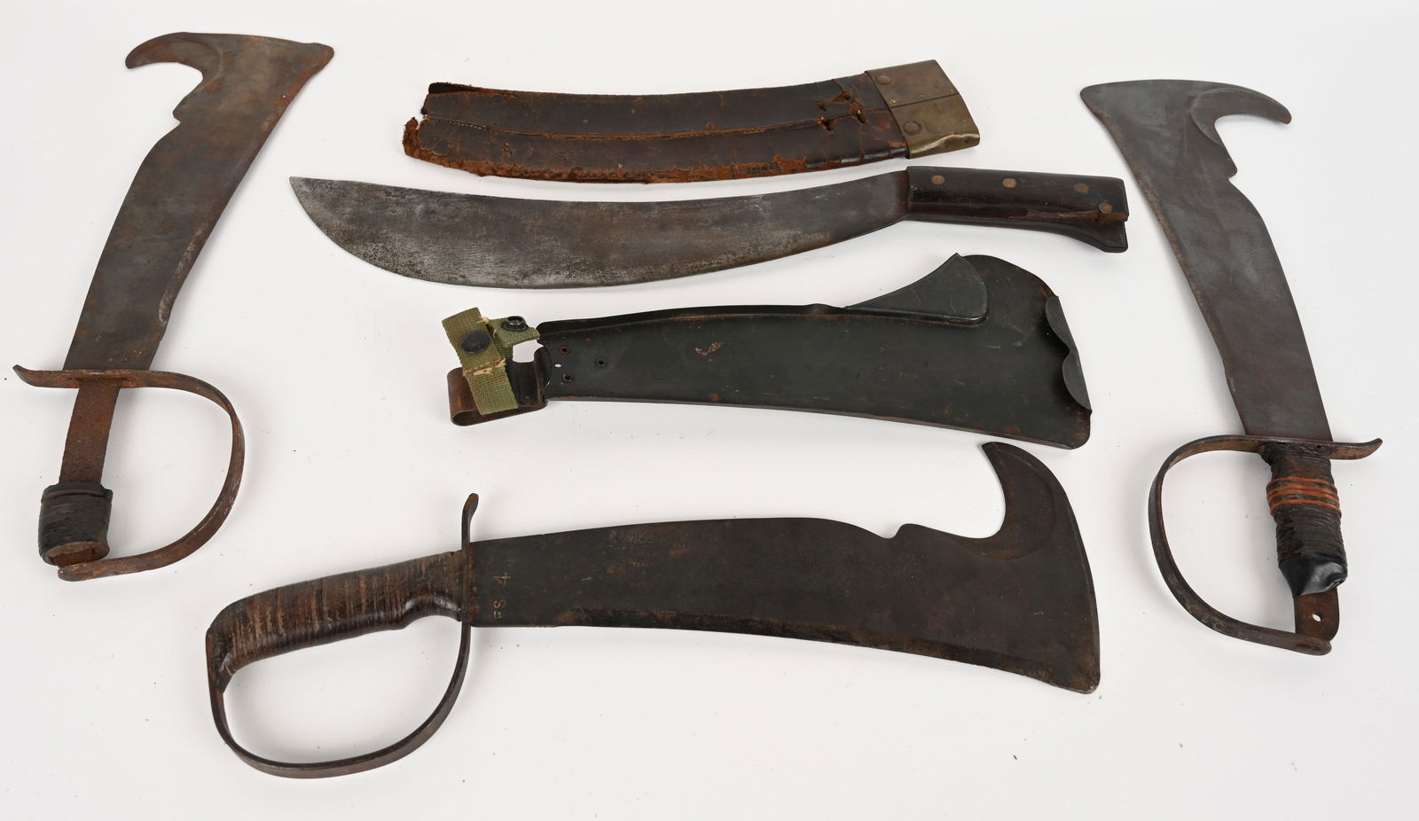 LOT OF 4 WWII ERA JUNGLE MACHETES: WWII US Collins & Co. No 1005 Engineer Bolo Machete with leather scabbard. blade is marked with manufacturer and "1005". Condition: Good considering its age. Blade is stained but sturdy. Wood handle i