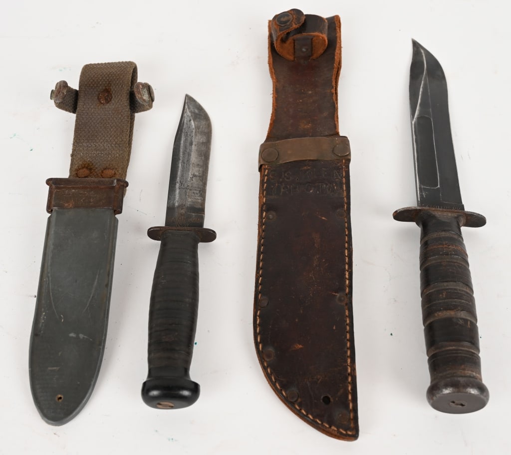 LOT OF USN MARK 1 AND MARK 2 KNIFE & SHEATH: This lot contains: (1) USN Mark 2 Camillus knife with leather sheath. Blade: 7:. OAL: 12". (1) USN Mark 1 Camillus knife with sheath. Blade: 5". OAL: 9 5/8". Condition: Good.