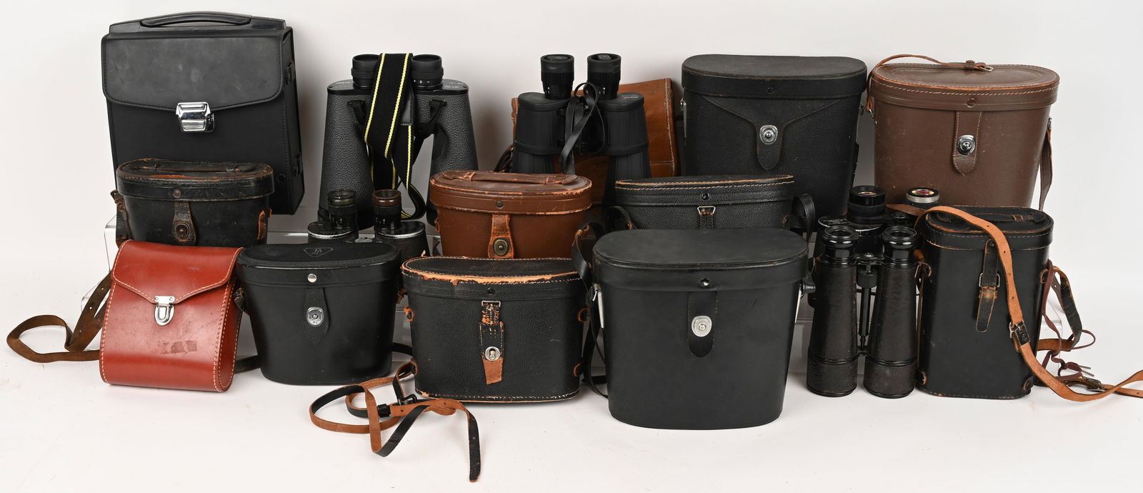 JUMBO LOT OF 12 VINTAGE & MODERN BINOCULARS: This lot contains: (1) Swift Navigator Mark I, 7x50 with leather case. Very Good glass (1) L. Petit Fabi Paris leather binoculars with black leather case (1) Tasco model 122, 8x40 with brown leather c