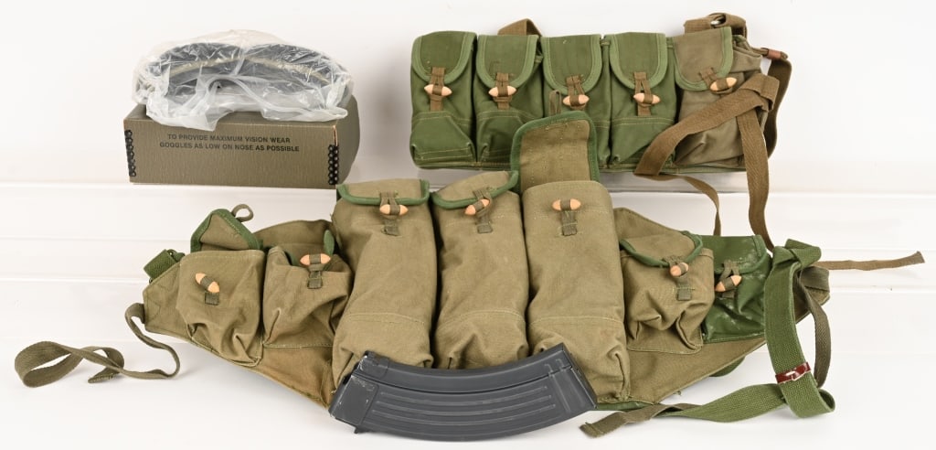 LOT OF CHINESE AK & SKS MAGAZINES & GI GOGGLES: This lot contains two Chinese chest rigs and USGI goggles. (1) 7 cell chest ring with (2) mag loaders and (6) Polytech metal 30 round magazines. (1) 10 cell SKS rig with (1) oil container. (1) USGI go