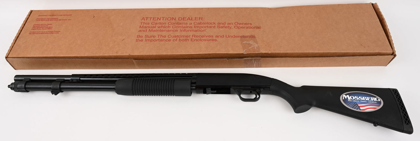 MOSSBERG MODEL 590 RIOT GUN 12 GA. PUMP ACTION: SERIAL NUMBER: V0610628. BARREL 21". CALIBER: 12 GA. CHAMBER: 3". MANUFACTURED: 2000s Features pistol grip nylon stocks, extended 9 round magazine, heat shield, parkerized / black finish. Matching fac