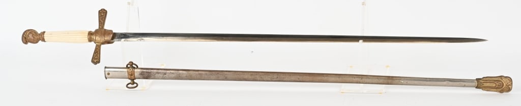 CIVIL WAR MILITIA OFFICERS SWORD W PLAIN BLADE: Non Regulation Militia Officers Sword. Pommel is in the form of a Knight's Head. Measures 36 inches overall with a 28 1/4 inch blade that is plain. Comes with a metal Scabbard with Brass Fittings. Exc