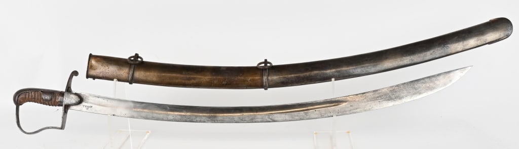 BRITISH MODEL 1796 CAVALRY SABER w/ SCABBARD: Massive Model 1796 British cavalry sword. 32 1/2" curved 1 9/16" wide blade. Iron "P" knuckle bow with leather over wood grip. The leather is worn and the twisted wire is missing. The blade is bright