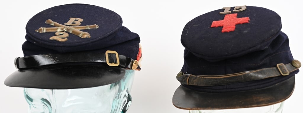 CIVIL WAR EARLY REENACTOR KEPI LOT: Lot of two, Civil War Reenactor Kepi's. One showing a 6th Ccorps Badge with 15th Regiment while the other is for the 2nd Artillery B Battery. Both are excellent showing age and wear. Perfect for displ