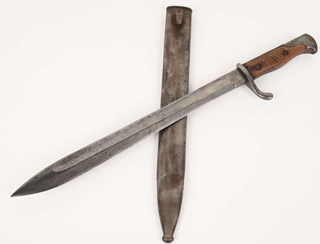 WW1 IMPERIAL GERMAN M98 BUTCHER BLADE BAYONET: 19 1/2" overall with 14 1/2" bright blade. Blade is maker marked Alex Coppel, very good grips, nice scabbard and is dated 1917 on the spine.