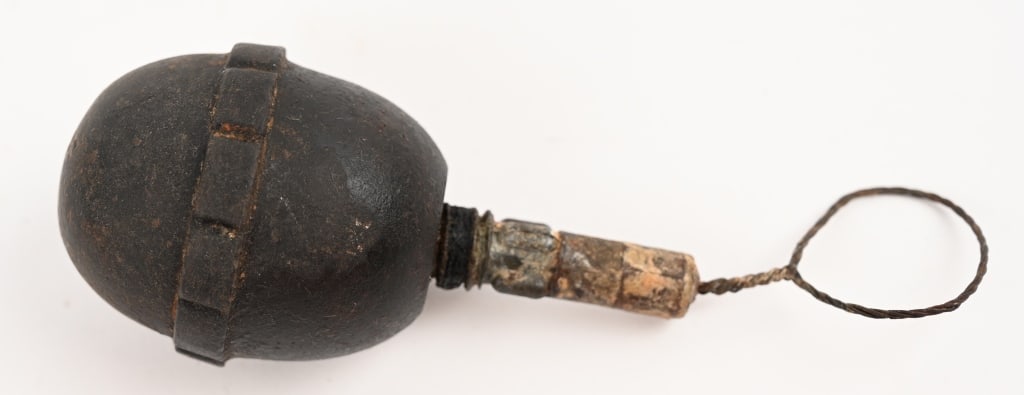 WW1 IMPERIAL GERMAN M1917 EGG GRENADE WWI: This example is the M1917 Eierhandgranaten n/A with a zinc 7 second fuse. Zinc from that period corrodes with oxygen, so all surviving zinc igniters are pitted to some degree. The hole on the side is