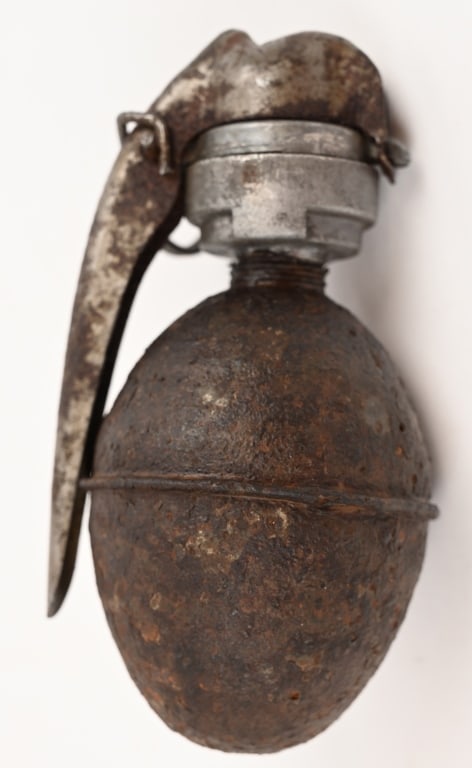 WW1 FRENCH HAND GRENADE W M1916 FUZE WWI: French WWI egg hand grenade. These were manufactured between 1915 and 1917. This example is totally inert without internal fuse or explosives. A rare addition to any Great War Collection. Shows pittin