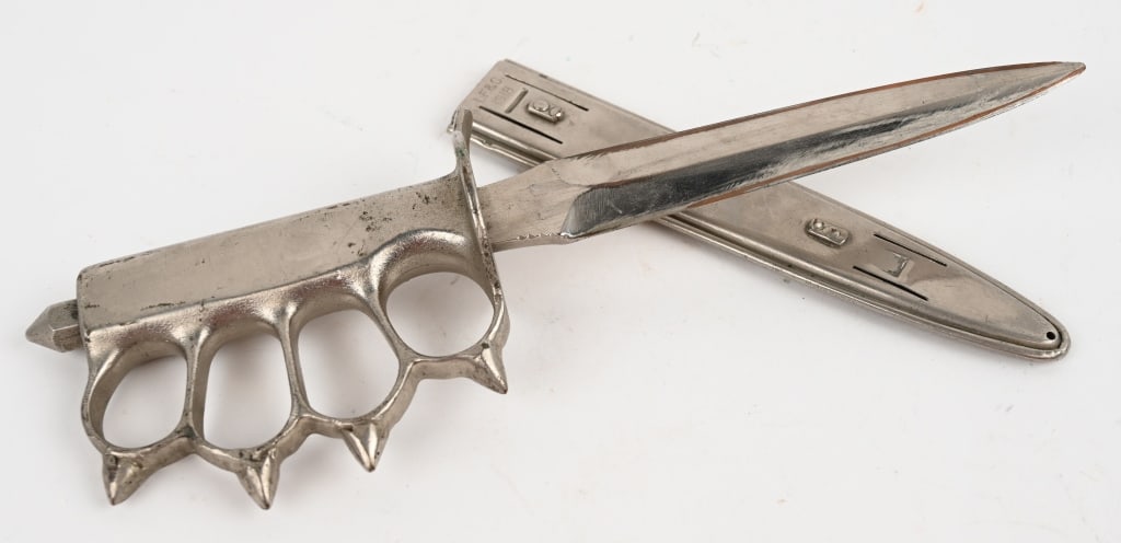 WWI US M1918 TRENCH KNIFE LF&C W/ SCABBARD WW1: Model 1918 "Knuckle Duster" Trench knife with solid brass handle made by Landers, Frary, and Clark that has been chromed on the handle, blade and on the scabbard. Features spiked knuckle guards, and "