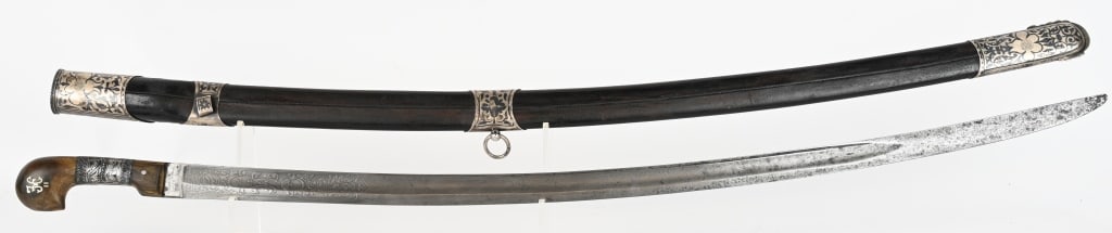 WW1 IMPERIAL RUSSIAN OFFICERS SHASHKA TSAR CYPHER: Beautifully engraved Officers Shashka of the time of Tsar Nicholas. The overall size is 41 1/2 inches with silver mounts to the leather wrapped scabbard. The ornate horn handle has the cypher of Tsar