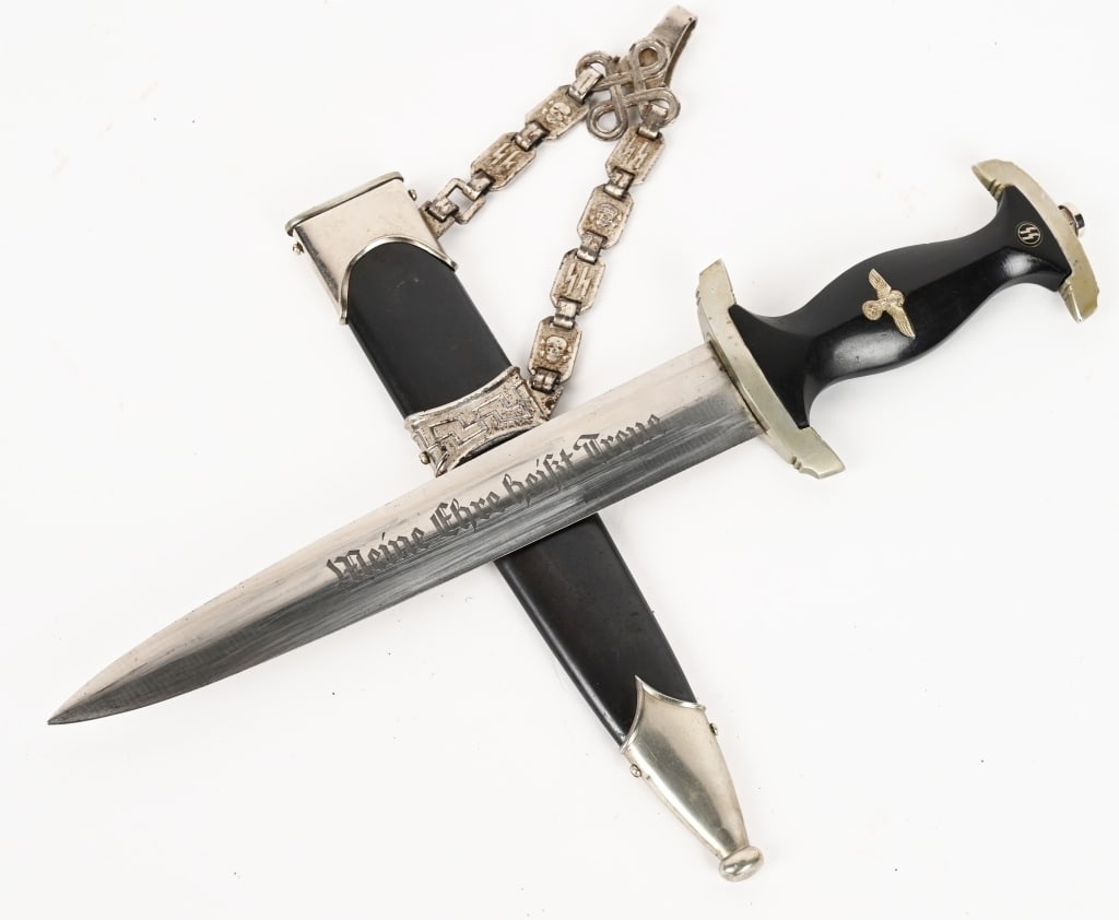 WWII NAZI GERMAN CHAINED M36 SS SERVICE DAGGER WW2: M36 service dagger features a roughly, 8 5/8", (22 cm), long, double edged, nickel/silver plated, drop forged steel construction blade with a low central ridge and a full length, including the hilt, o