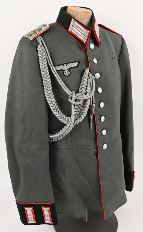 WWII NAZI GERMAN OFFICERS NAMED M35 WAFFENROCK WW2: Named and dated 1939 to Hauptmann of the artillery being a high quality private purchase field-gray wool/tricot blend construction M35 dress tunic features a vertical eight button front closure with d