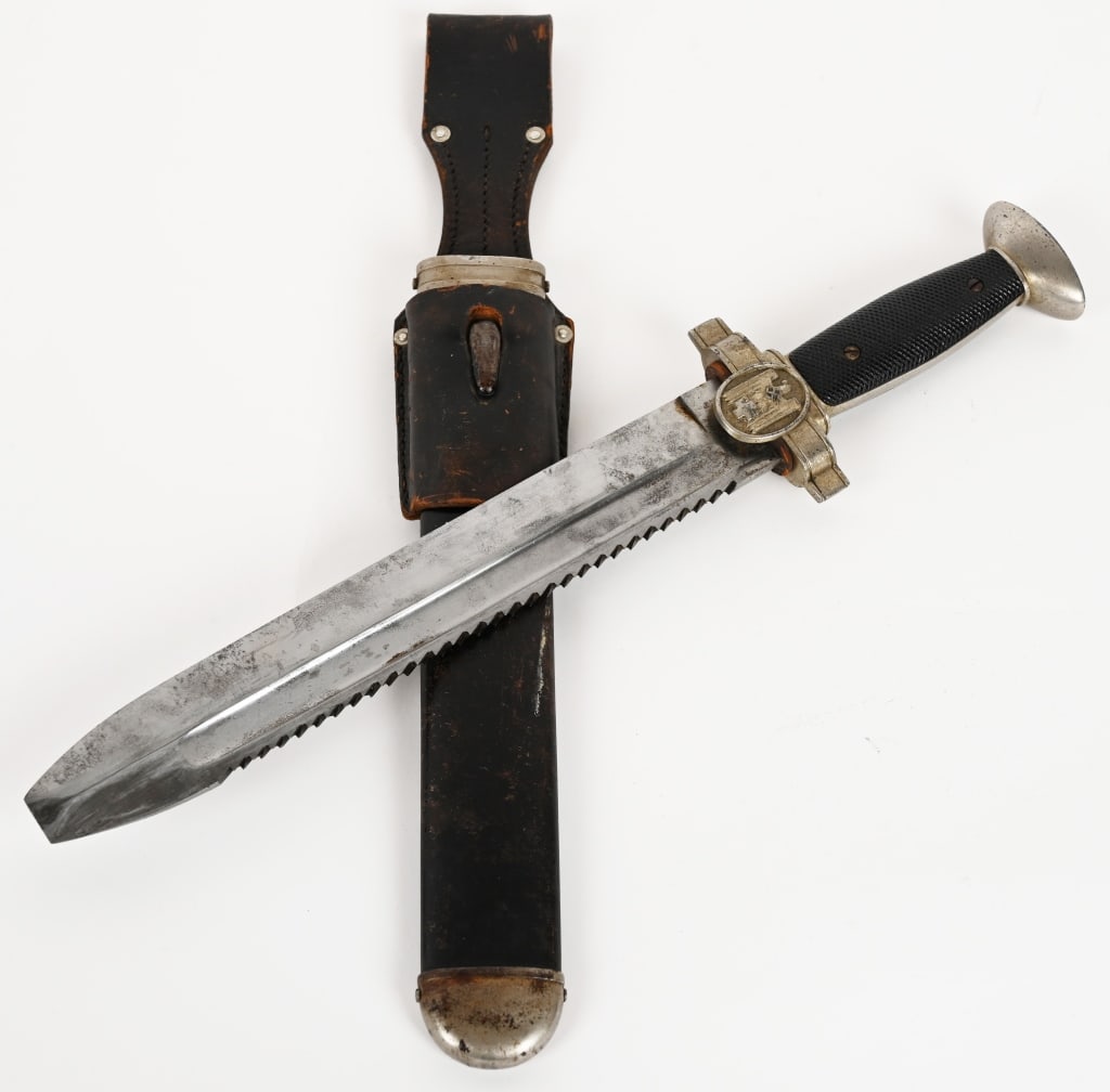 WWII NAZI GERMAN RED CROSS HEWER EM DAGGER WW2: Model 1938 Deutsches Rotes Kreuz (German Red Cross) Hewer. The blade is untouched and in excellent condition. The sharp teeth to the saw back are in perfect condition. The blade is not maker marked. T