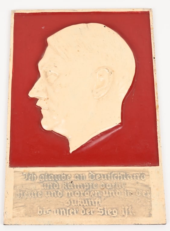 WWII NAZI GERMAN ADOLF HITLER IRON WALL PLAQUE WW2: WWII Nazi German painted iron wall hanger of Adolf Hitler measuring 8 1/2 X 12 1/2 inches . To the obverse a side profile of Hitler with the inscription "Ich glaube an deutschland und kämpfe dafu