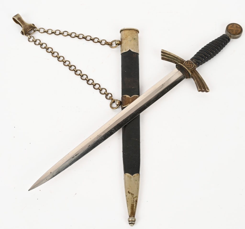 WWII NAZI GERMAN 1ST MOD. LUFTWAFFE DAGGER HORSTER: 1st Model (1934/35) Luftwaffe dagger and hanger with nickle silver crossguard, pommel, and scabbard fittings. Blade marked E F Horster Solingen with their logo. Leather grip has minor wear with all wi