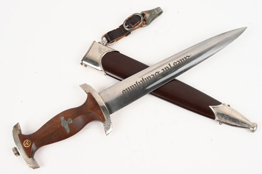 WW2 NAZI GERMAN SA M33 DAGGER M7/36 E.F. HORSTER: SA dagger with a 22cm long double-edged drop-forged, and nickel-silver plated blade in its original scabbard. The dagger has a cast pommel and tang nut. Its contoured wooden grip has, inlaid to its ob