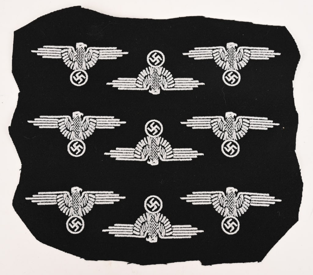 WWII NAZI GERMAN WAFFEN SS SLEEVE EAGLE LOT OF 9: Second pattern, (Circa 1939-1945), machine embroidered, SS sleeve eagle lot of 9 with out-stretched wings in silvery/gray, rayon threads on a black wool base. This is the final pattern machine embroid