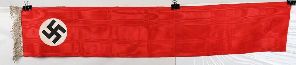 WWII NAZI GERMAN NSDAP FUNERAL SASH WW2: WWII Nazi German Funeral Sash measuring 8 X 42 inches in red rayon/silk material with white disk with black swastika on one side. Excellent.