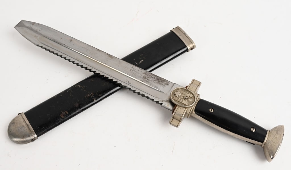 WWII NAZI GERMAN RED CROSS HEWER EM DAGGER WW2: Model 1938 Deutsches Rotes Kreuz (German Red Cross) Hewer. The blade is untouched and in excellent condition. The sharp teeth to the saw back are in perfect condition. The blade is not maker marked. T