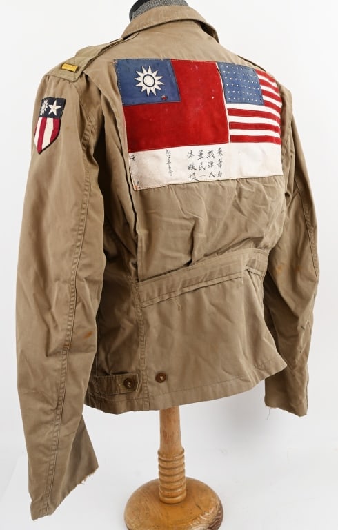 WWII ARMY AIR CORPS BLOOD CHIT PATCHED M41 JACKET: Exquisitely patched M41 Field Jacket with a stellar leather blood chit to the reverse as well as a CBI Shoulder Sleeve Patch. To the shoulders are 2nd Lieutenant Bars. Jacket has a fully function