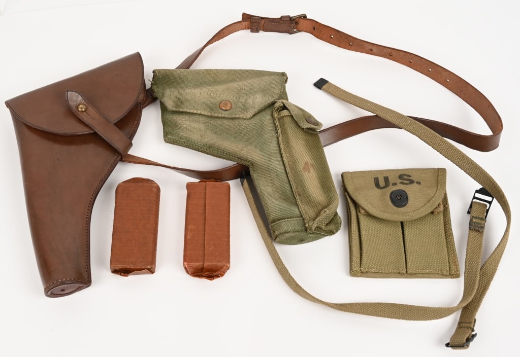 US & BRITISH AMMO POUCH & WEBLEY HOLSTER LOT WW2: Lot of two and ammo pouches with magazine and WWII British Webley Holsters to include 1) Leather British Webley Holster that was used by J. Bramwell R.N.V.R Royal Naval Volunteer Reserve. Holster is m