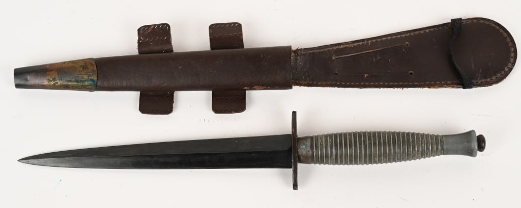 WWII BRITISH FAIRBAIRN SYKES FIGHTING KNIFE WW2: WWII British Fairbairn Sykes Fighting Knife measuring 11 1/2 inches overall with a stiletto blade that measures 6 3/4 inches. Cast zinc grip is marked 3 on the pommel. Crossguard is also marked Broad 