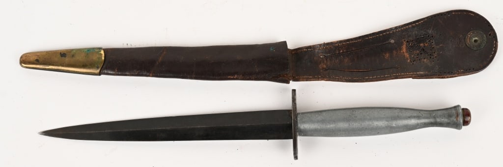 WWII BRITISH FAIRBAIRN SYKES FIGHTING KNIFE WW2: Unusual Fairbairn Sykes Fighting Knife with a smooth grip measuring 11 1/2 inches overall with a stout stiletto blade that measures 6 3/4 inches. The crossguard is marked with a broad arrow as well to