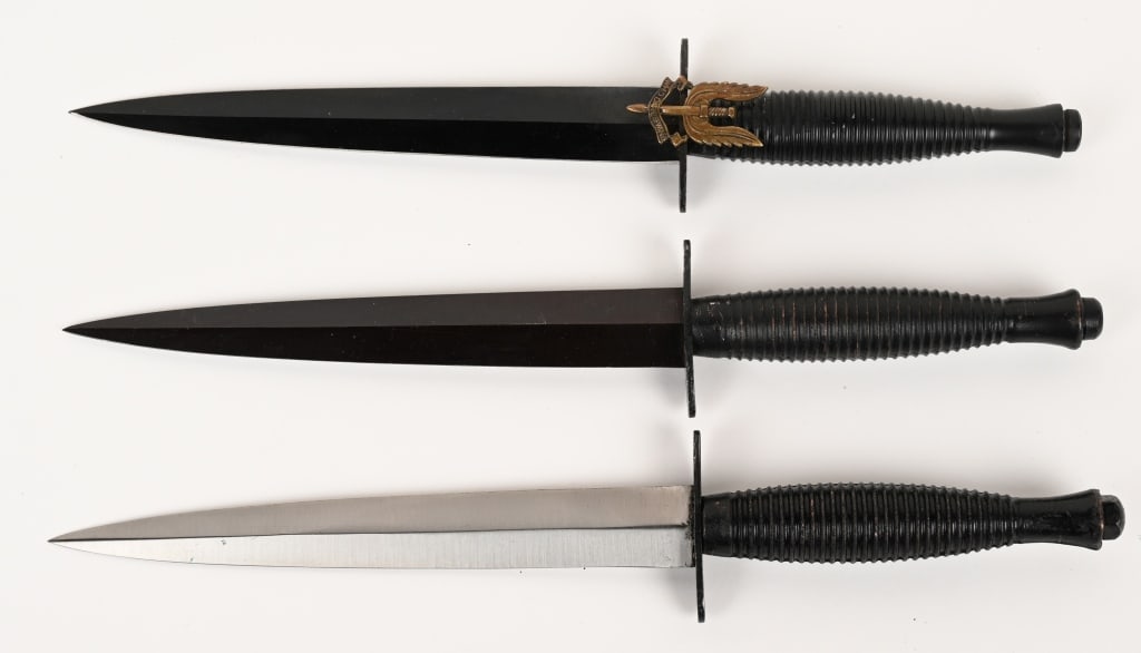 BRITISH FAIRBAIRN SYKES FIGHTING KNIFE: Lot of 3, British Fairbairn Sykes Fighting Knives measuring 11 3/8 inches overall with a stiletto blade that measures 6 1/2 inches. Zinc cast grips are excellent. The bright blade dagger has crossed k