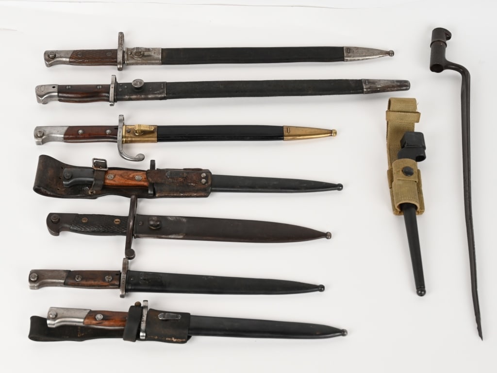 WWI BAYONET LOT BRITISH SPANISH YUGOSLAVIAN WWII: Bayonet lot to include 1) Yugoslavian M1924 Short Rifle Bayonet & Frog. Original finish wooden grips with flush ground securing screws. Sound oil finished brown leather frog. Matching numbers on guard