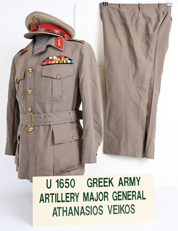 GREEK ARMY MAJOR GENERALS UNIFORM W VISOR HAT: Very attractive Greek Army Artillery Major Generals Uniform Grouping complete with Visor Hat. Uniform has an extensive Ribbon Bar in excellent condition and is roughly a size 38R. The Uniform came to