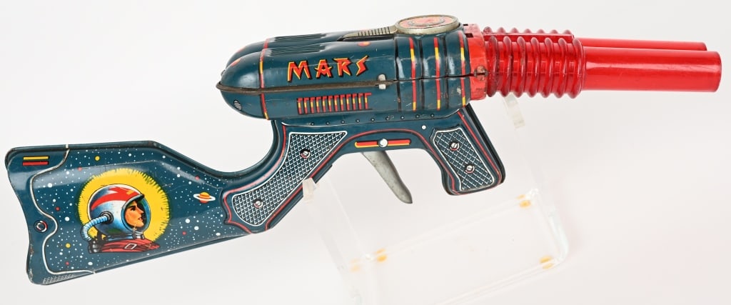 JAPAN TIN MARS SPACE RIFLE: Japan tin Mars Space Rifle. All original with nice colors and graphics. Still works. 14" Excellent