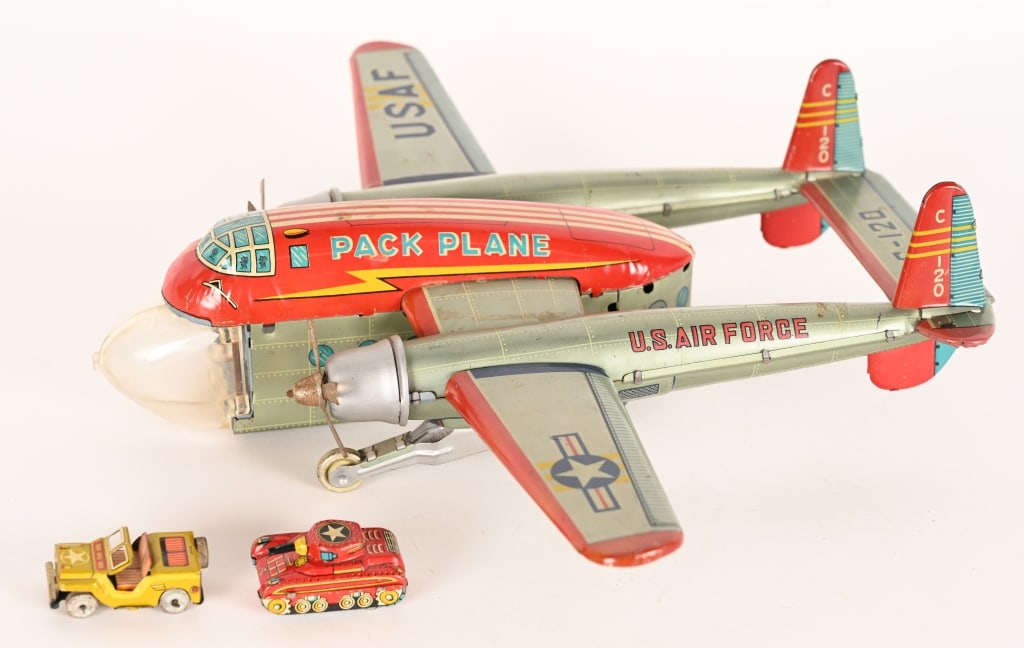 JAPAN TIN FRICTION USAF PACK PLANE: Japan tin friction USAF Pack Plane. All original condition. Comes with original Tank and Jeep. Friction works. Has some minor wear and small crack in plastic front. 13" Excellent