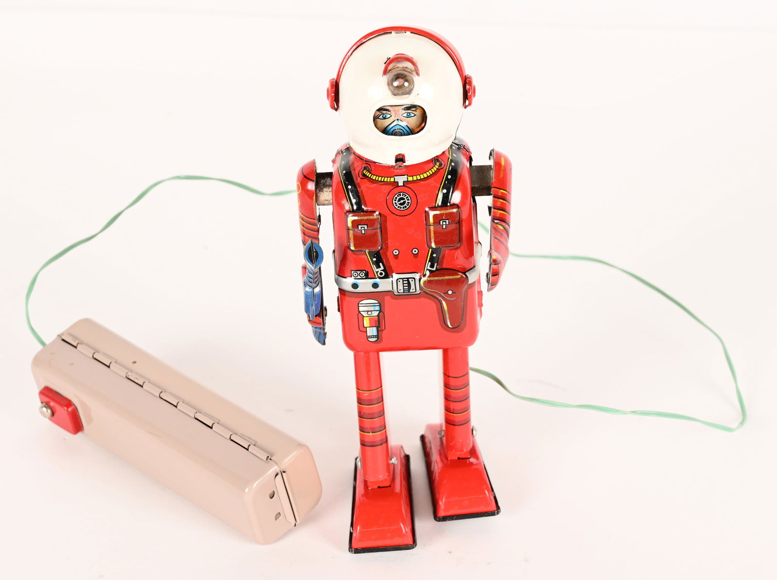 LINEMAR BATTERY OP PORTHOLE SPACEMAN: Japan battery operated Porthole Spaceman. All original with very nice colors and details. Has correct pink battery box remote contol. In very good shape with paper battery instructions. Worked when