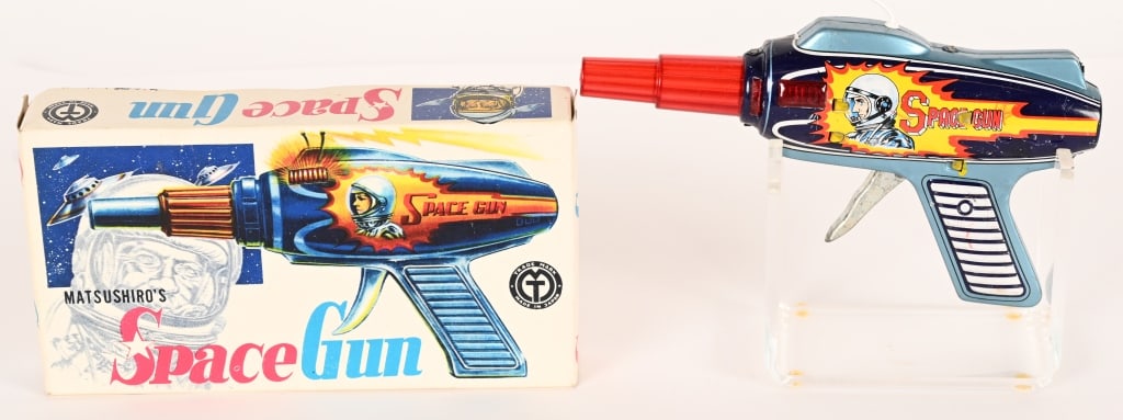 JAPAN TIN FRICTION MATSUSHIRO'S SPACE GUN w/ BOX: All original with great colors and graphics. Looks never played with. Works. Boxed. 8" Excellent