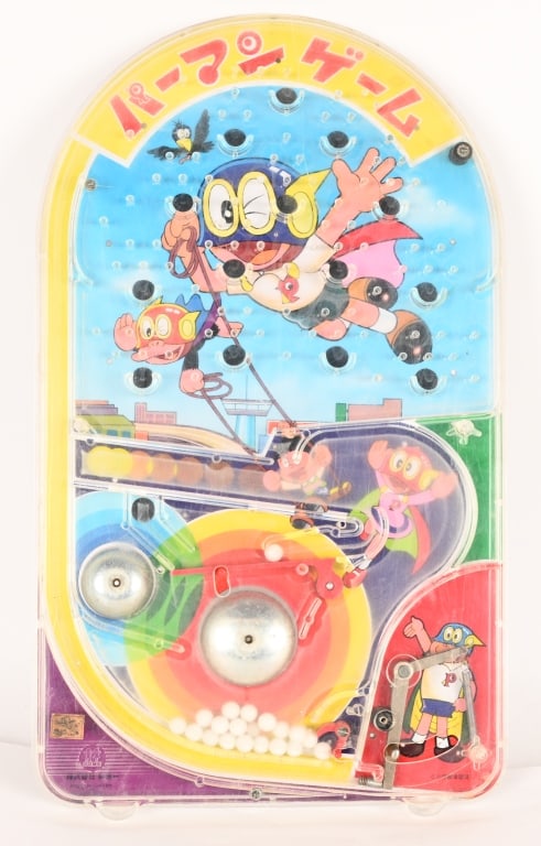 JAPAN PERMAN BAGATELLE GAME: Vintage Perman Bagatelle Game. Has great graphics., Small crack in plastic. Displays well. 19" Very Good