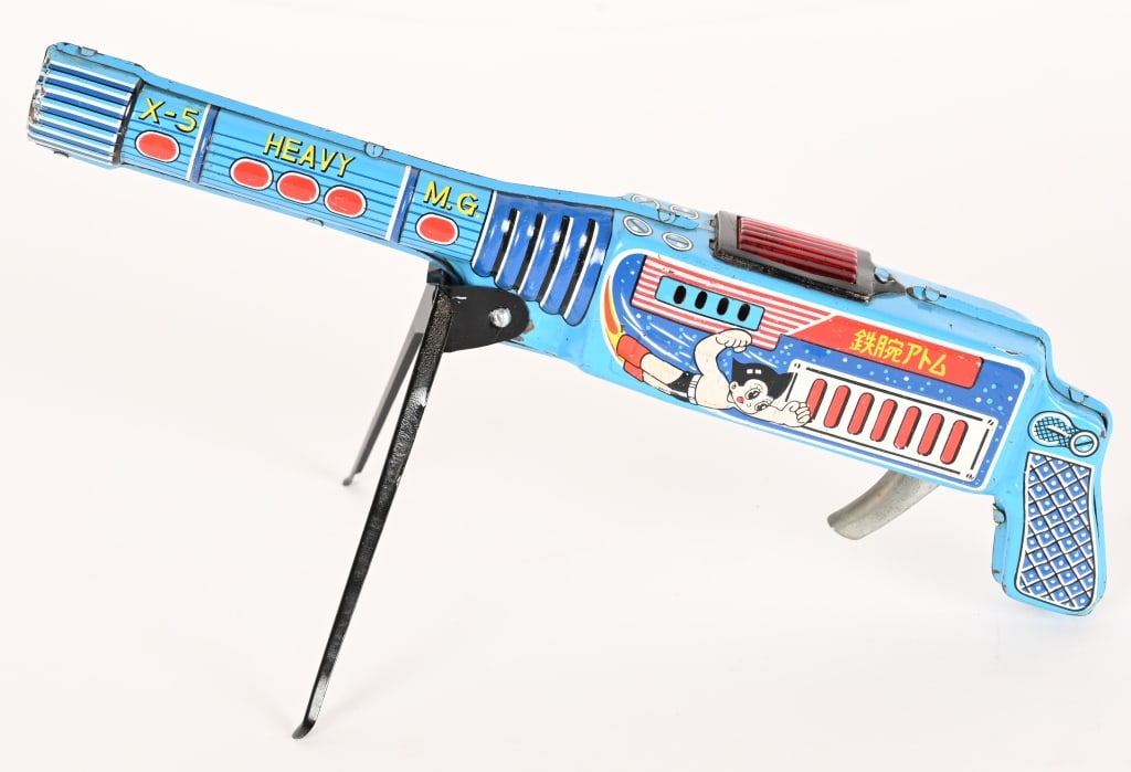 JAPAN TIN FRICTION ASTROBOY MACHINE GUN: Nice looking tin Machine Gun with Astroboy graphics. Still works. Great shape. 12" Excellent