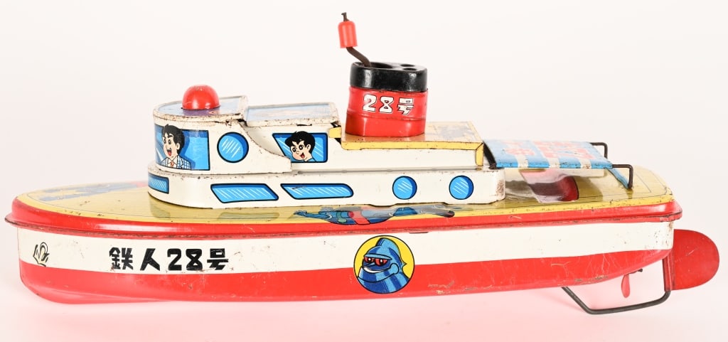 YONEZAWA TIN WINDUP TETSUJIN TUG BOAT: Japan tin windup Tetsujin Tug Boat. All original with great colors and graphics. Windup works. Has some normal wear. 13" Excellent