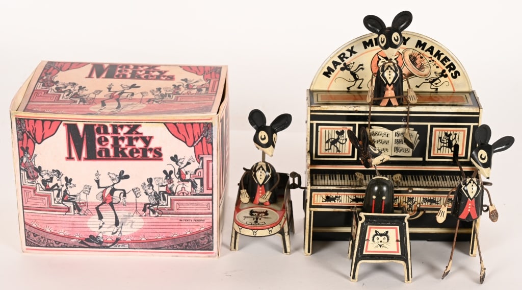 MARX TIN WINDUP MERRY MAKERS BAND: Marx tin windup Merry Makers Band. Version with Marquee. All original and complete. Nice condition. Windup works. Comes with reproduction Box. 8" Excellent